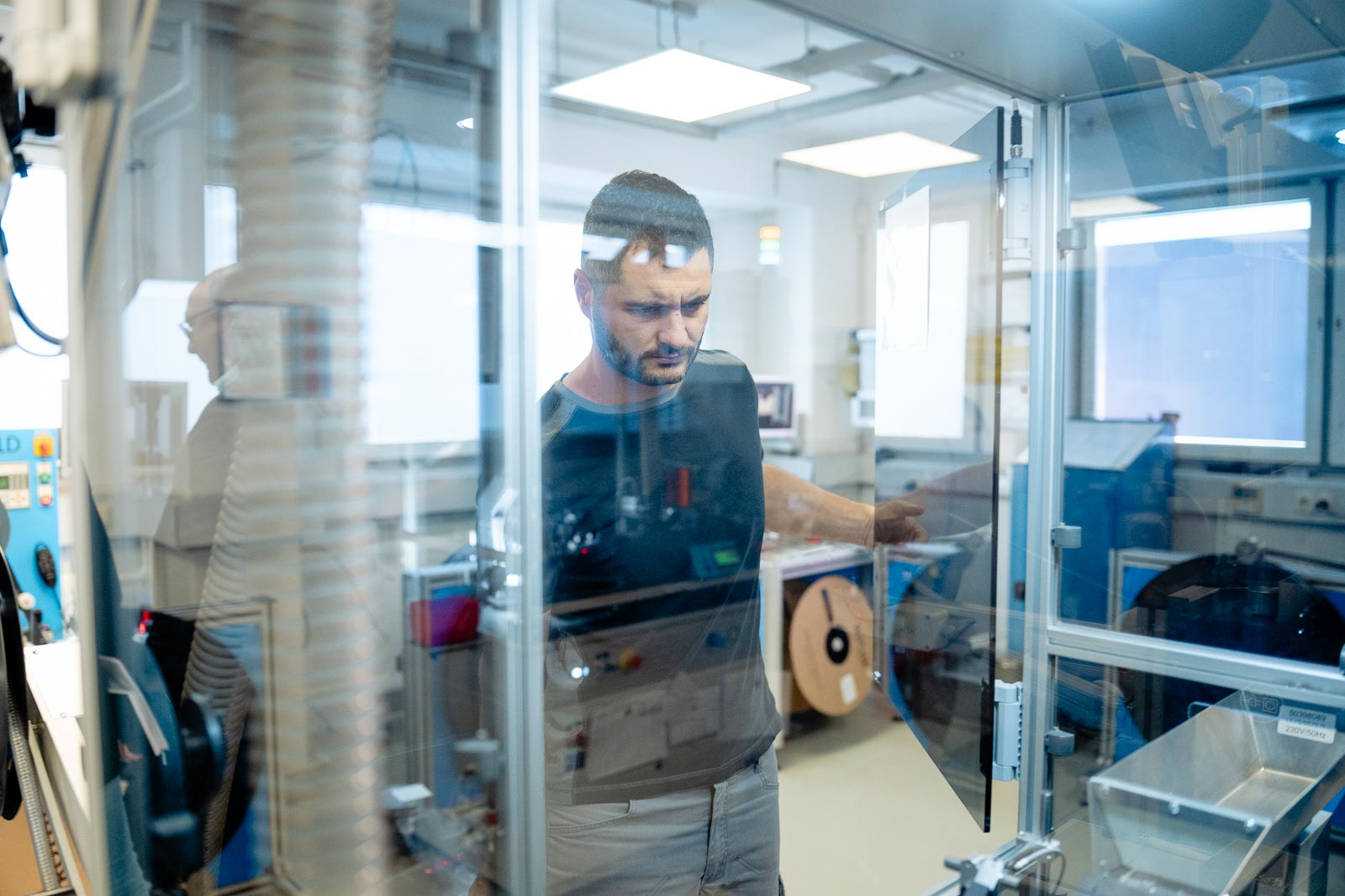 a man looking at a glass door